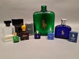 several bottles of perfume are sitting on a white surface