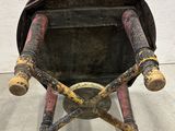 an old chair that is sitting in the middle of a room