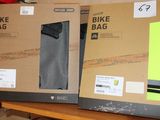 two boxes of bike bags on a shelf in a store
