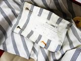 a close up of a shirt with a tag on it