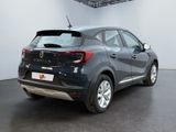 a picture of a car parked in a showroom