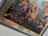 a picture of a picture of a woman riding a horse