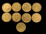 six souverains d'or de tailles et de formes diverses