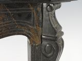 an antique cast iron fireplace mantel with a black marble top