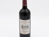 a bottle of wine that is sitting on a table