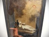 an old painting of a woman laying on a bed in a room
