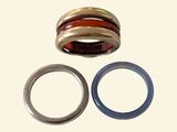 two rings and a ring that are on a white surface