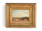 un tableau représentant un paysage, dans un cadre doré, accroché à un mur blanc