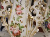 three vases that have been decorated with flowers on them