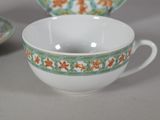 a cup and saucer sitting on a table