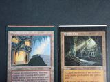 two cards that are sitting next to each other on a table
