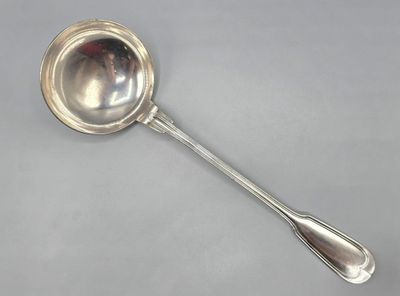 a close up of a spoon with a spoon handle on a table