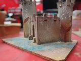 a small model of a castle on a table