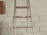 a ladder that is leaning against a wall in a garage