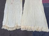 pair of women ' s nightgowns with lace trims on them