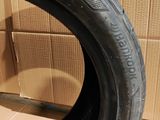 an image of a tire on a cardboard box with a cardboard box in the background