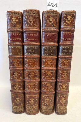 six old books are stacked on top of each other on a white surface