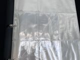 the inside of a black binder with clear plastic covers