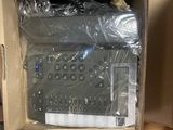 two boxes with remote controls in them sitting on the floor