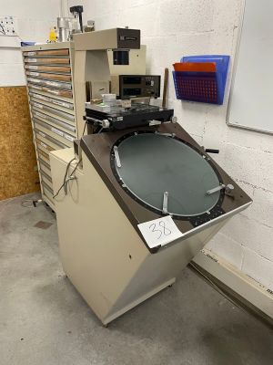 a machine that is sitting in a room with a whiteboard