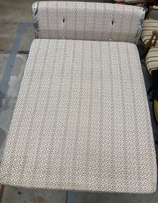 two couches that are sitting on a table