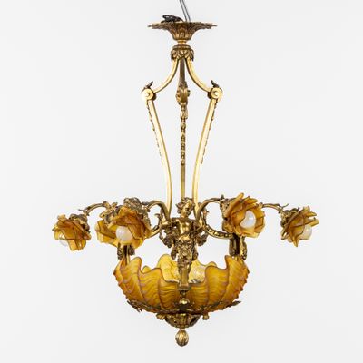 une image d'un lustre d'où pendent des fleurs, suspendu au plafond