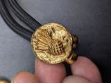 a person holding a gold coin in their hand