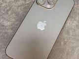 a close up of a silver iphone sitting on top of a table