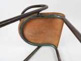 a wooden chair with a metal handle and a wooden seat