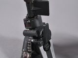 a small camera sitting on top of a tripod