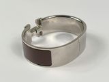 silver bracelet with black enamel inlay and cross