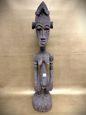 an image of a statue of a person with a hat on