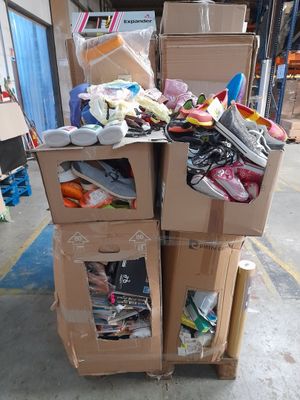 many boxes stacked on top of each other in a warehouse