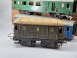 two toy trains sitting next to each other on a table