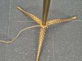 a gold umbrella that is on the ground by the door