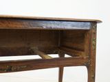 a small wooden table with a drawer on top of it