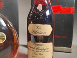 a bottle of brandy next to a bottle of brandy