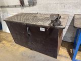 a metal box that is sitting in a garage