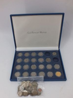 an image of a box of coins sitting on top of a table