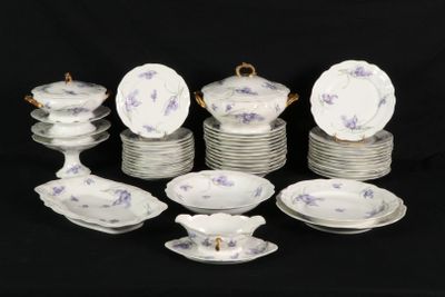 a lot of plates and bowls that are on a table