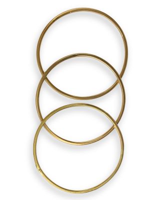 a set of three gold rings on a white background