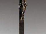 bronze crucifix with jesus on the cross on a pedestal