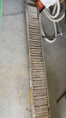 a picture of a conveyor belt in a warehouse