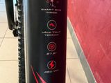 a close up of a bike with a sticker on the back of it