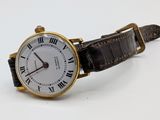 a watch with roman numerals on the face of it