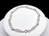 an image of a diamond bracelet on a white plate