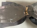 a black bow tie with a hole in the middle of it