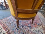 a chair that is sitting on a rug on the floor