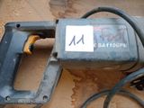 a picture of a corded electric tool on the ground