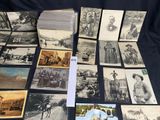 several old black and white photographs of men and women on a table